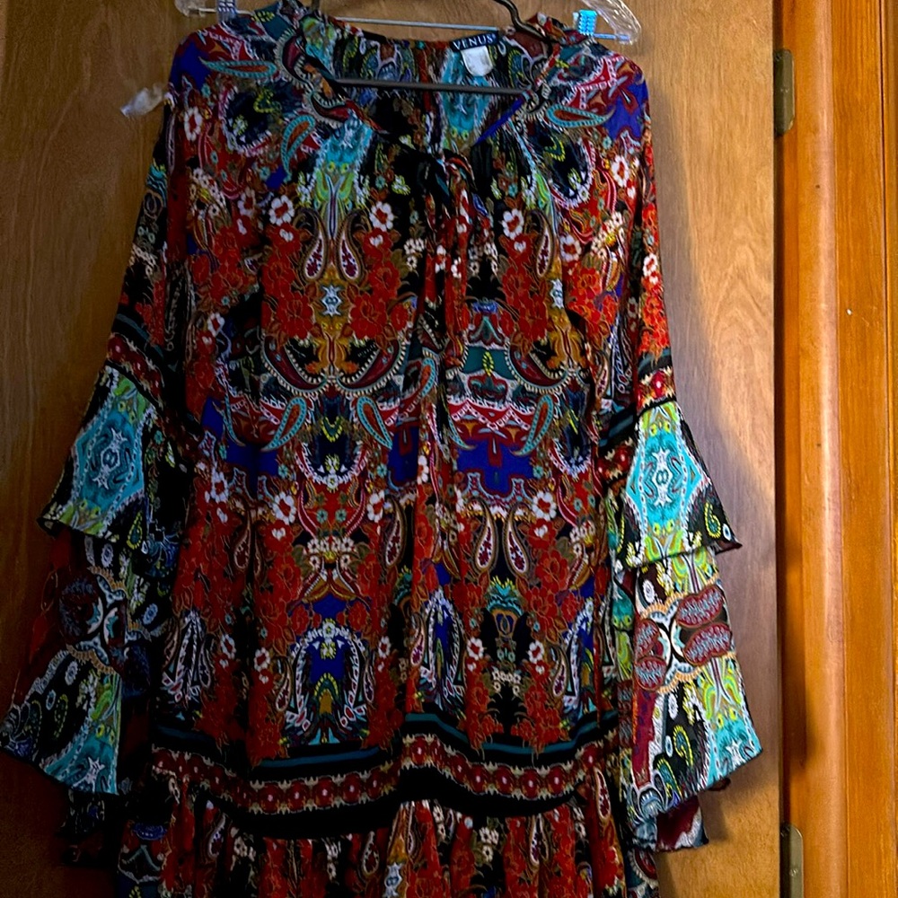 Loose fitting dress with black slip attached.